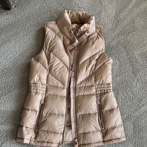 Athleta rose gold puffer vest. Really pretty color. No rips, tears or stains.